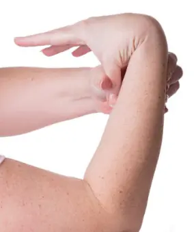 A person bends their thumb back until it touches their forearm